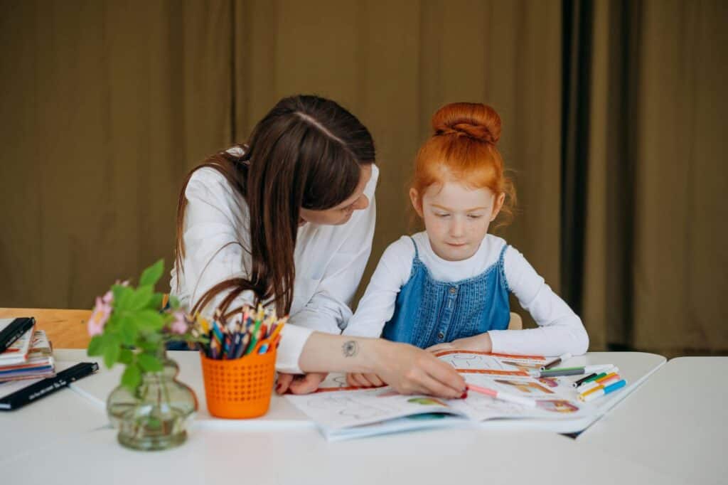 Parent and child working together on an activity, illustrating parental support and engagement in strategies.