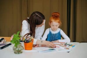 Parent and child working together on an activity, illustrating parental support and engagement in strategies.